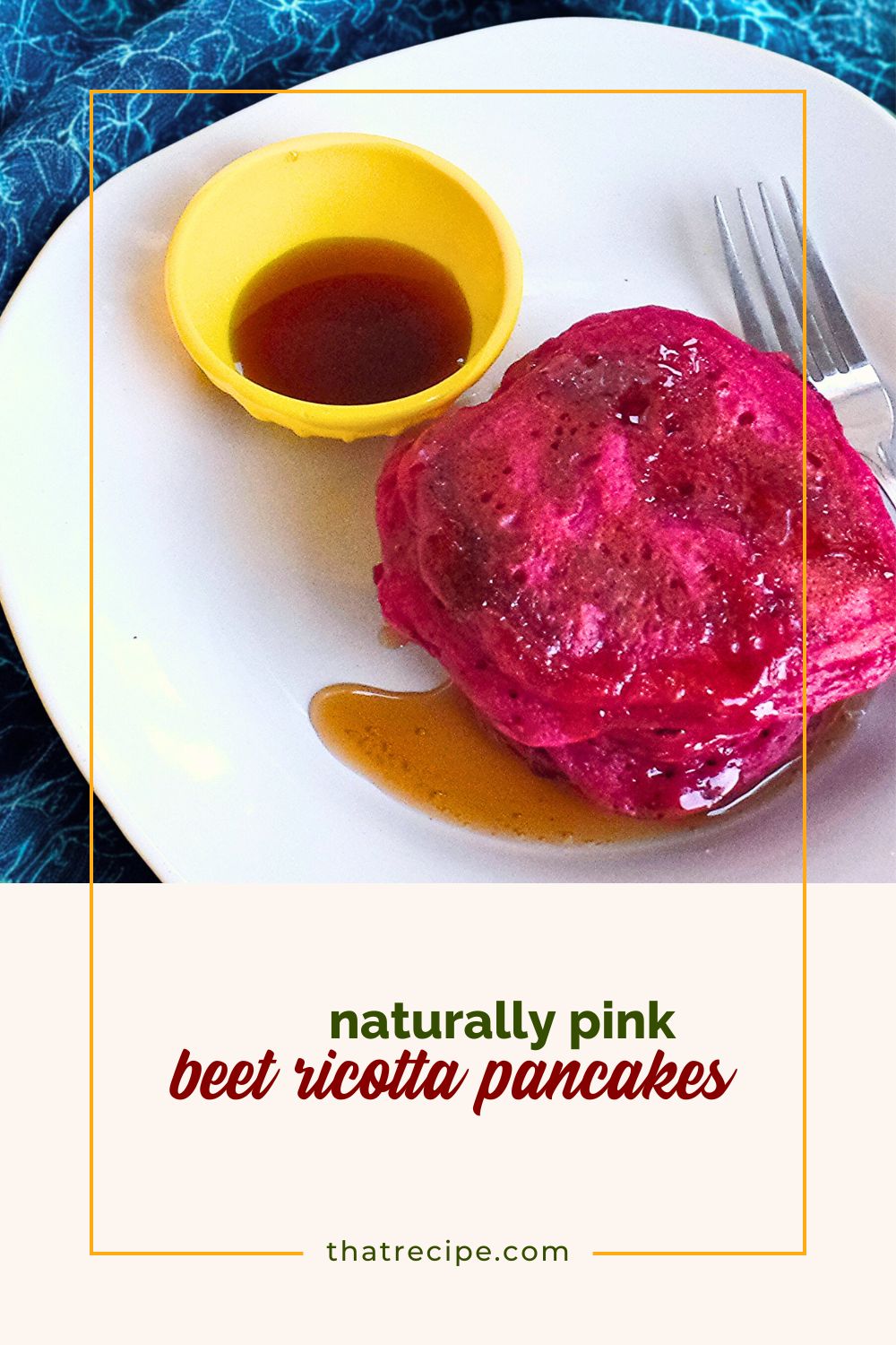 pink pancakes on a plate with syrup