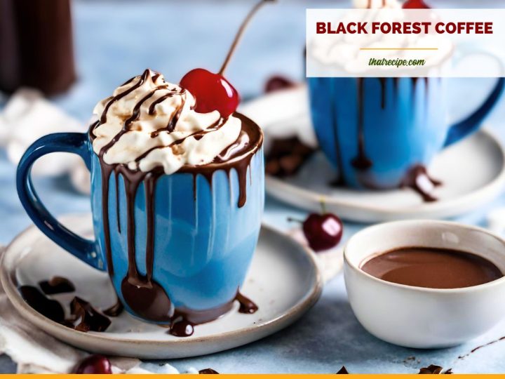 cup of whipped cream covered coffee with cherry on top