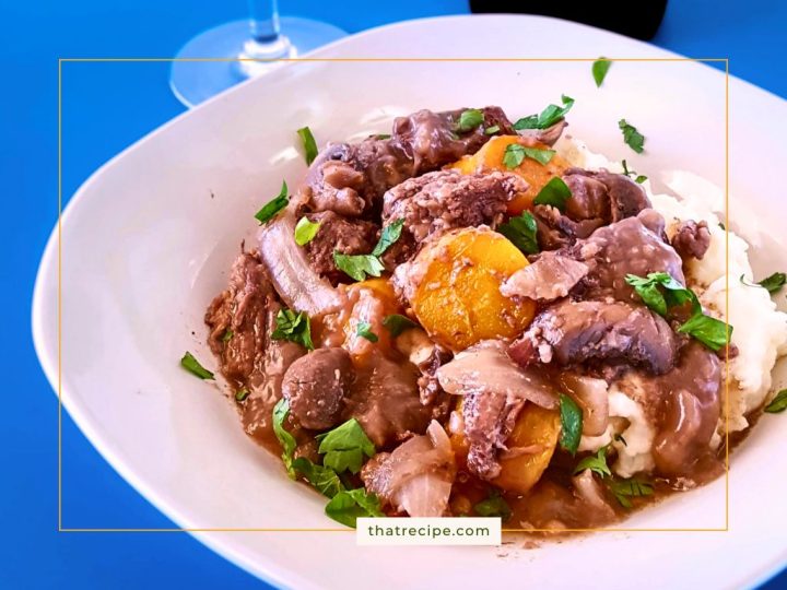 beef burgundy (boeuf bourguignon) over mashed potatoes