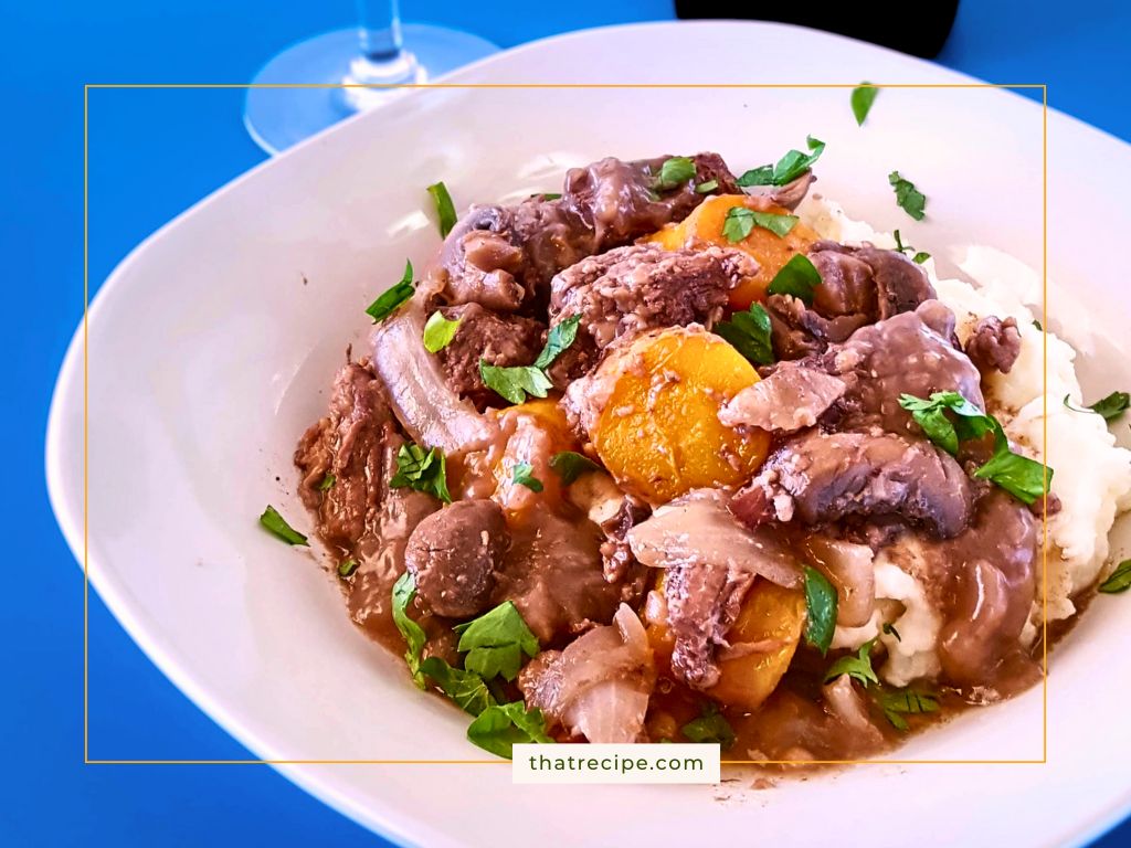 beef burgundy (boeuf bourguignon) over mashed potatoes