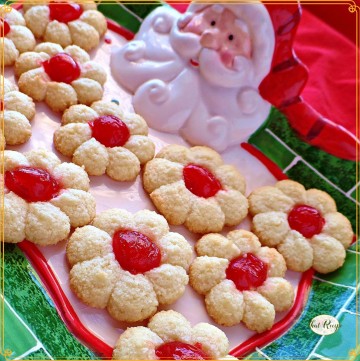 top down view of spritz cookies with cherries on top