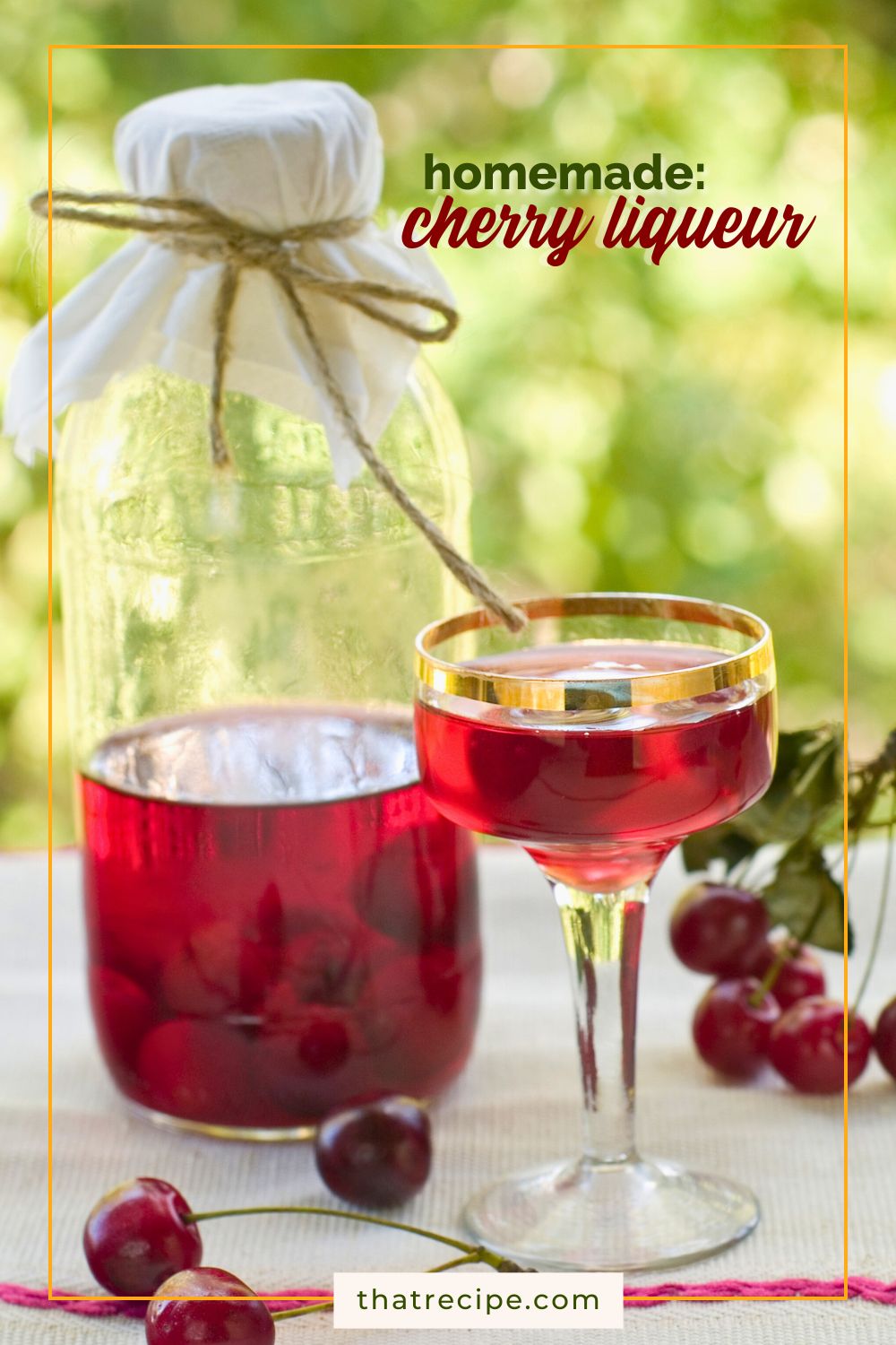 cherry liqueur in a cup and a bottle