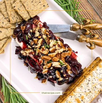 cherry pecan sauce on a block of cream cheese