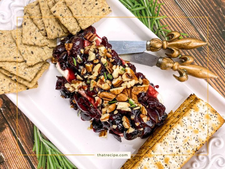 cherry pecan sauce on a block of cream cheese