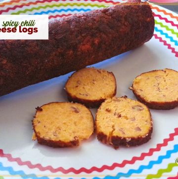 sliced chili cheese roll on a plate text overlay "spicy chili cheese logs"