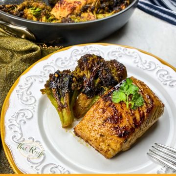 chile lime mahi mahi on a plate with blackened broccoli