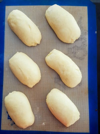 risen chocolate croissants on a pan