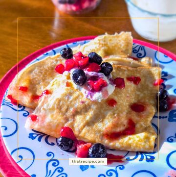 Crepes topped with berries and ricotta cheese