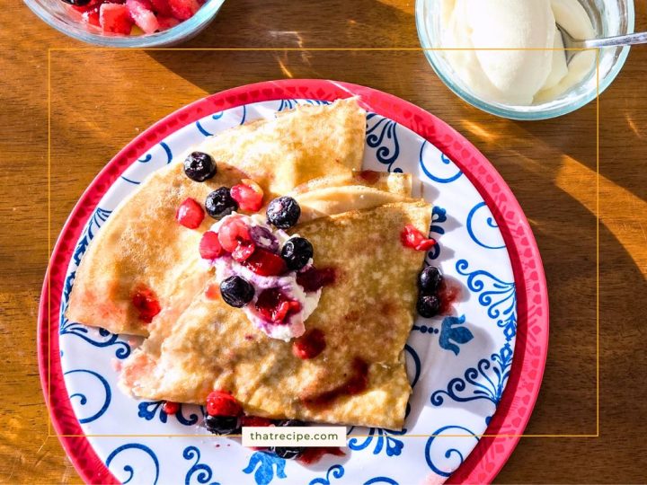 Crepes topped with berries and ricotta cheese