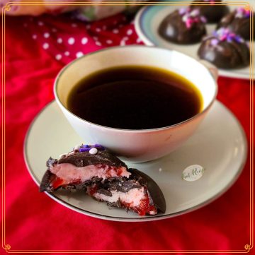 dark chocolate cherry truffle with cup of coffee