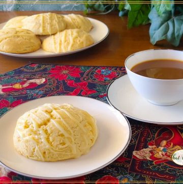 homemade eggnog scones on a plate with coffee