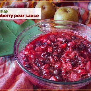 bowl of gingered cranberry pear sauce on a table with Asian pears