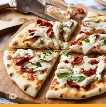 white pizza with chicken sun dried tomatoes and basil