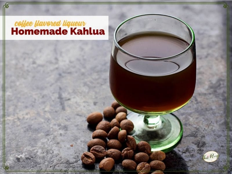 glass of liqueur on a table with coffee beans and text overlay "coffee flavored liqueur Homemade Kahlua"