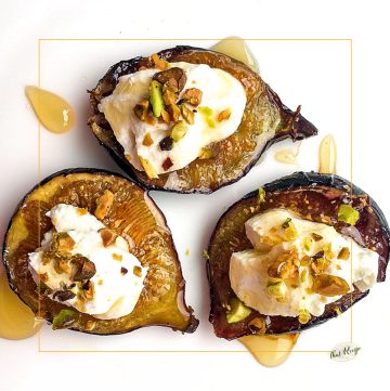 top down view of figs topped with cheese and nuts