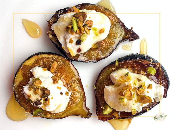 top down view of figs topped with cheese and nuts