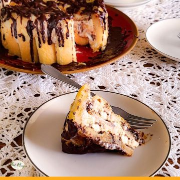 slice of ice cream cake on a plate with text overlay "ladyfinger ice cream cake"