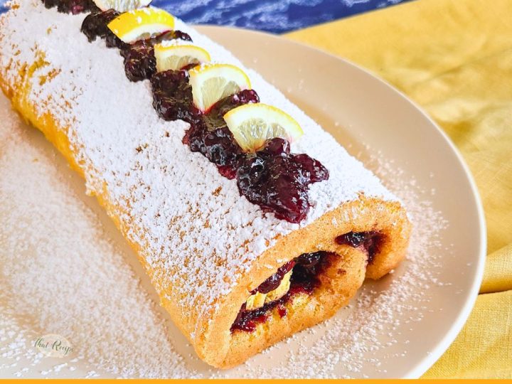 lemon blueberry jelly roll cake on a plate
