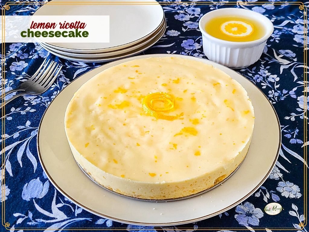 homemade cheesecake on a plate with text overlay "lemon ricotta cheesecake"