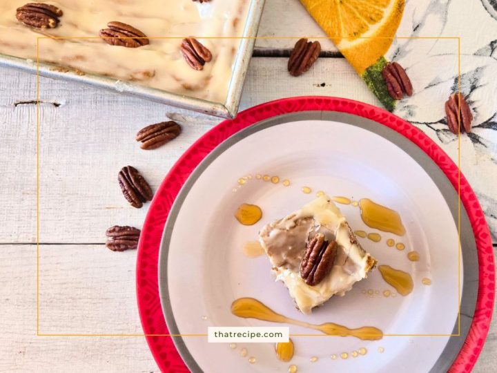 Frosted pecan blondies on a plate