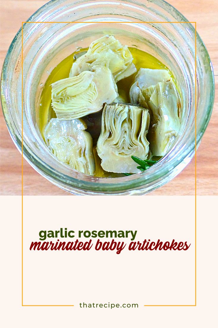 baby artichokes in a jar with text overlay "marinated baby artichokes"