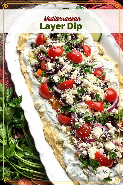 Layered hummus dip with text overlay "Mediterranean Layer Dip"