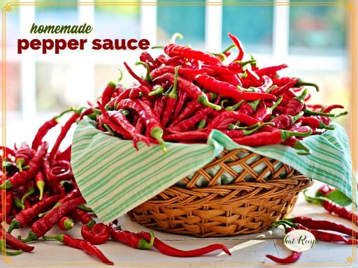 chili peppers in a basket with text overlay " homemade pepper sauce"