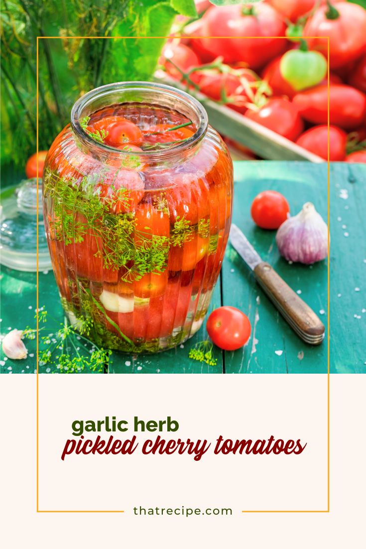 cherry tomatoes in a jar with fresh herbs, garlic and liquid