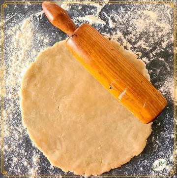 pie dough rolled out on a counter