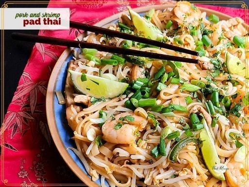 top down view of boodles with shrimp and text overlay "pork and shrimp pad thai"