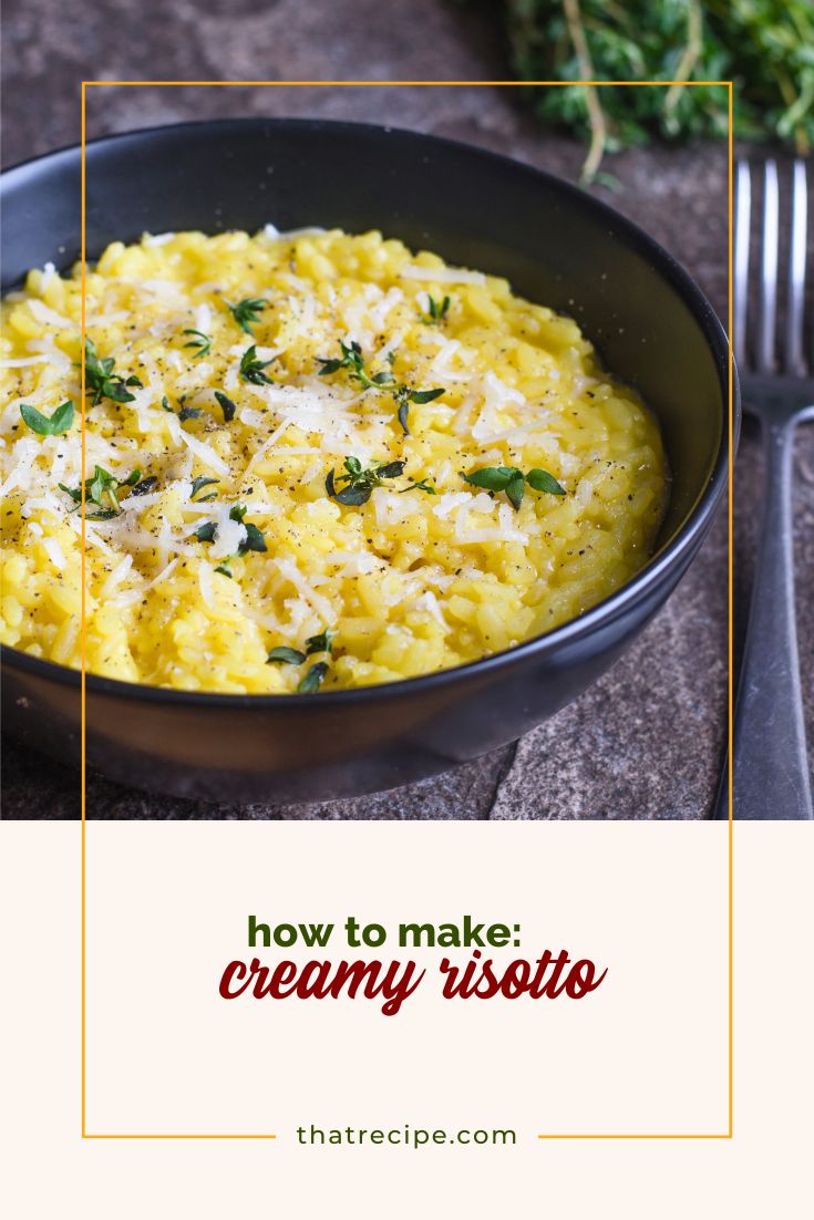 risotto in a bowl topped with Parmesan cheese and herbs
