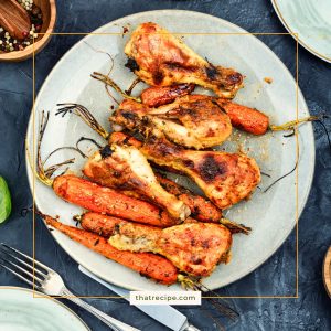 top down view of roasted drumsticks and carrots