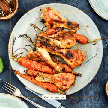 top down view of roasted drumsticks and carrots