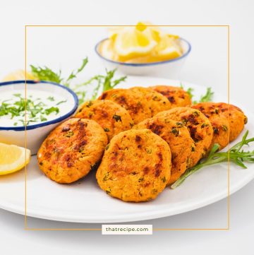 salmon cakes on a plate with creamy feta sauce
