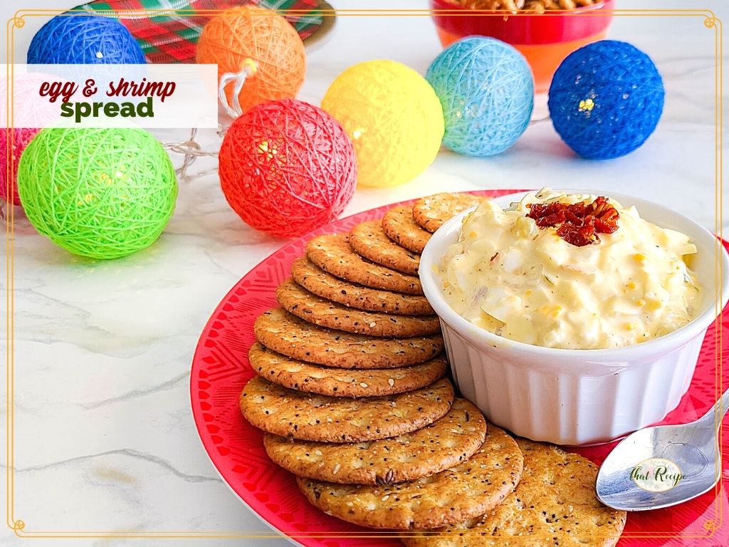plate of crackers and egg spread with text overlay "egg and shrimp spread"