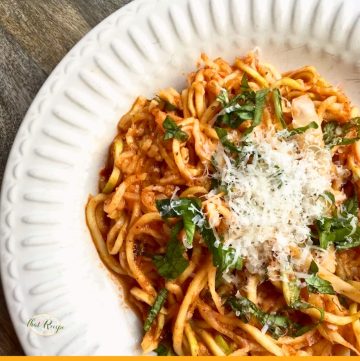 zucchini noodles with pasta sauce and parmesan