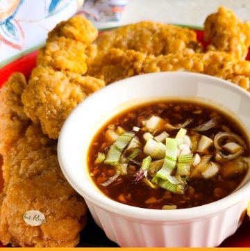 bowl of asian sauce with text overlay "spicy garlic ginger sauce"