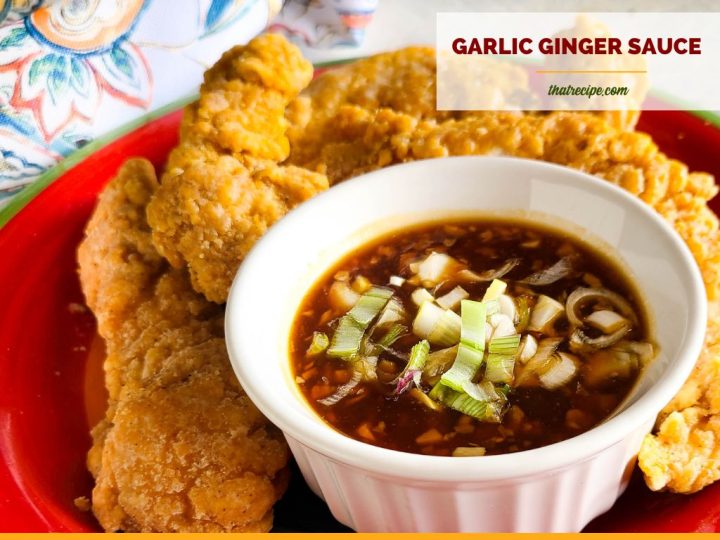 bowl of asian sauce with text overlay "spicy garlic ginger sauce"