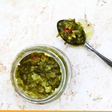 top down view of pickle relish in a glass jar and on a spoon