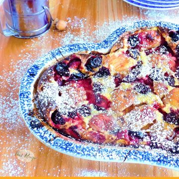 clafoutis topped with peaches, plums and cherries