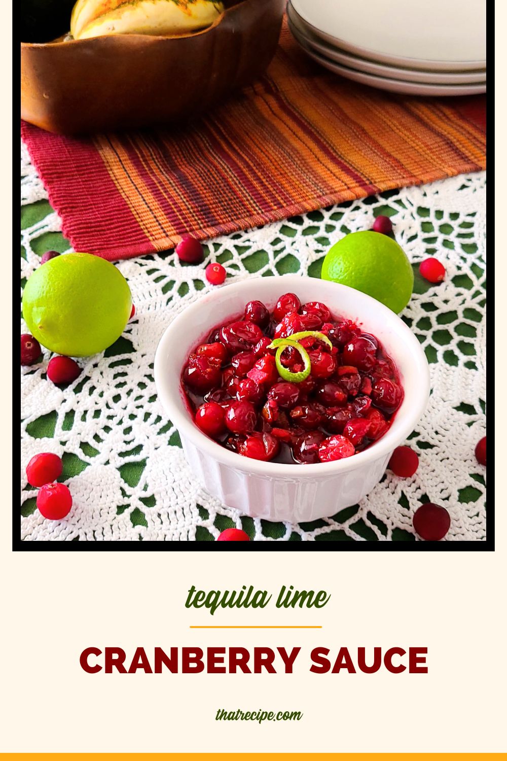 bowl of cranberry sauce on a table with text overlay "tequila lime cranberry sauce"