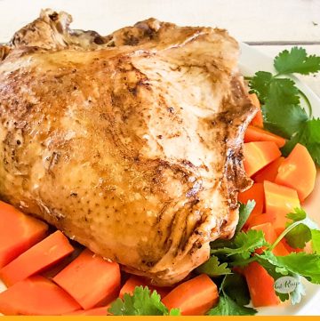 turkey breast on a platter with carrots