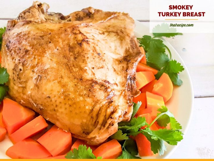 turkey breast on a platter with carrots