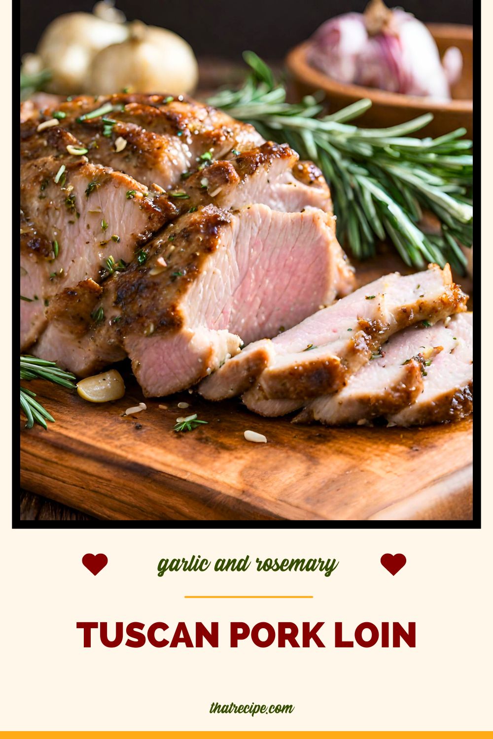 pork roast on a cutting board with rosemary and garlic