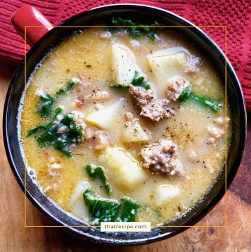 Sausage and white bean soup with kale in bowl