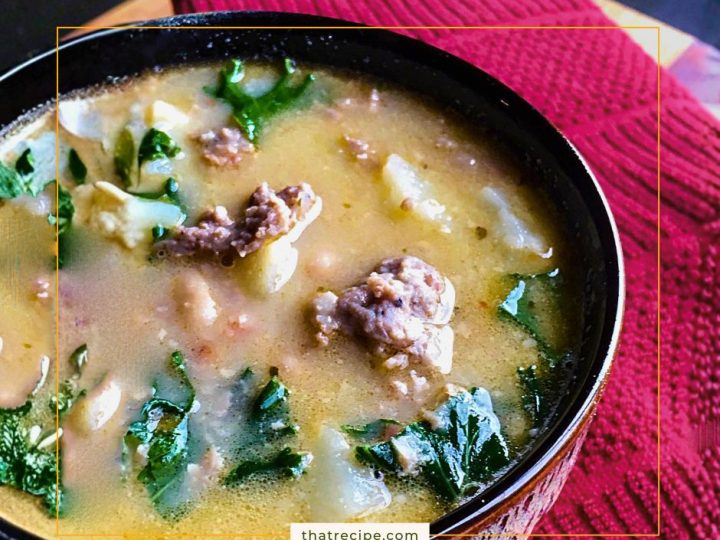 Sausage and white bean soup with kale in bowl