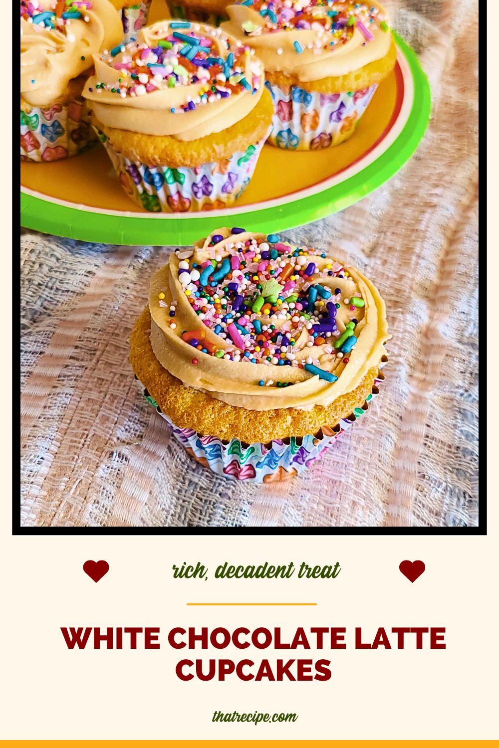 white chocolate cupcake with tan frosting and sprinkles